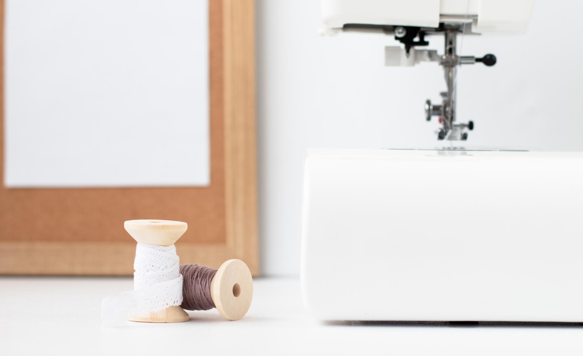 studio workspace with machine and threads